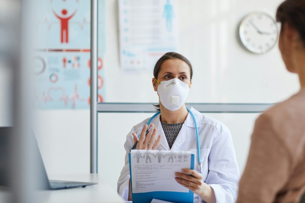 Doctor explaining the recognizing  signs of abuse.