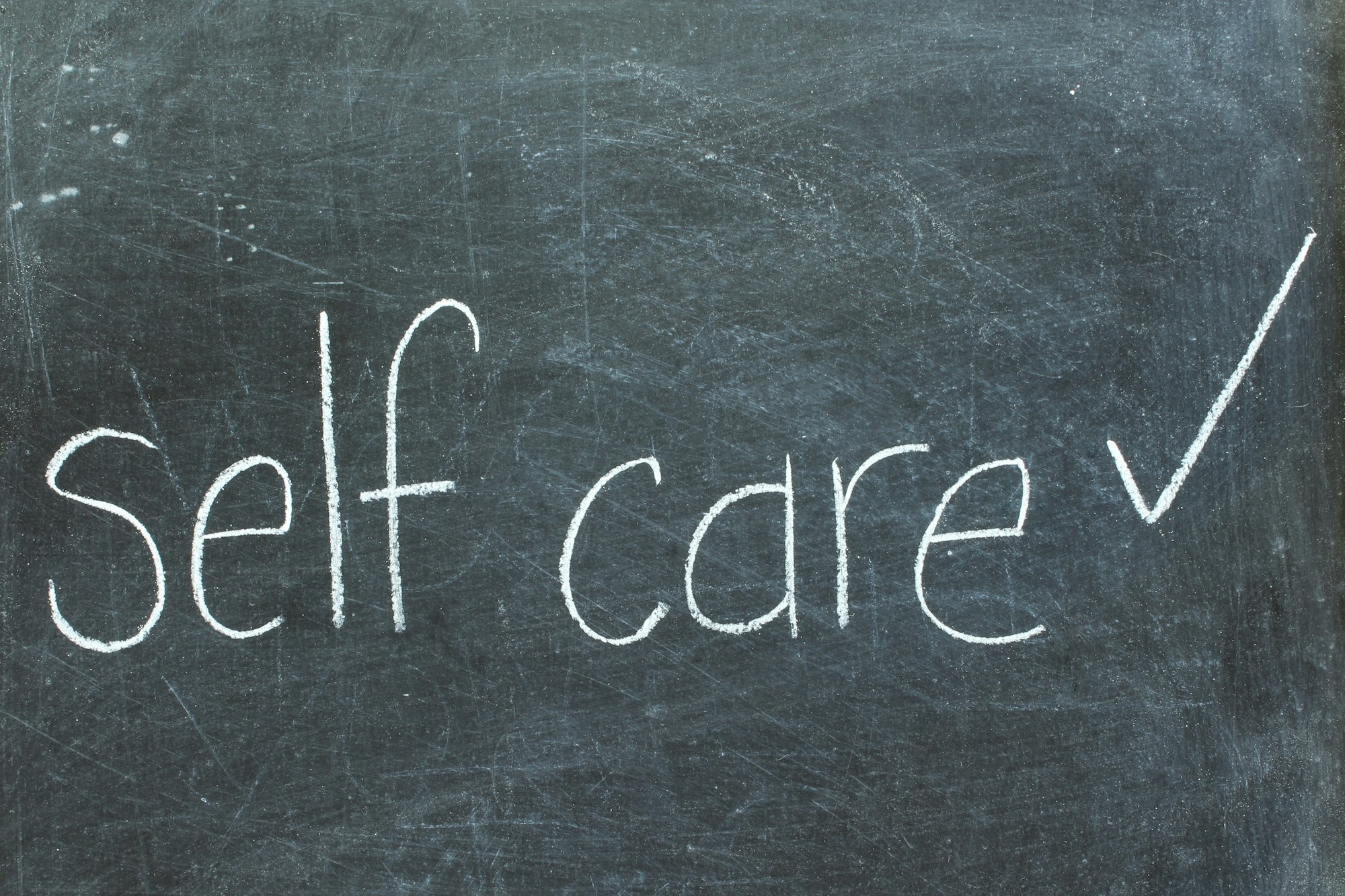 Self care on chalkboard