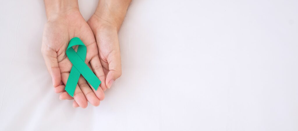 Meet the Needs of Sexual Assault Survivors with a teal awareness ribbon. 